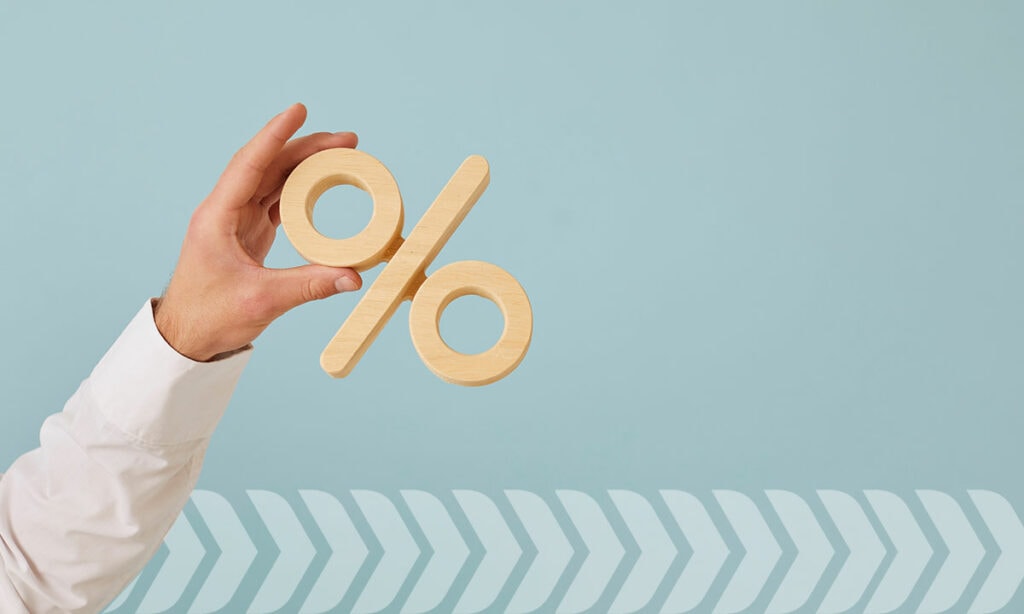 man holding percentage sign