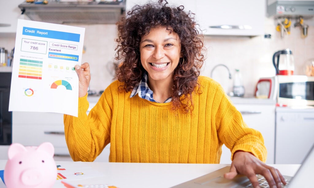 a woman showing off her good credit score